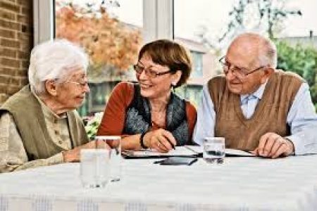 Professional meeting elderly couple